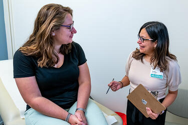 clinician and patient in exam room